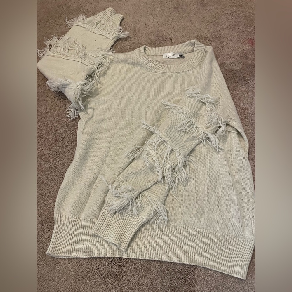 Medium Tan sweater.